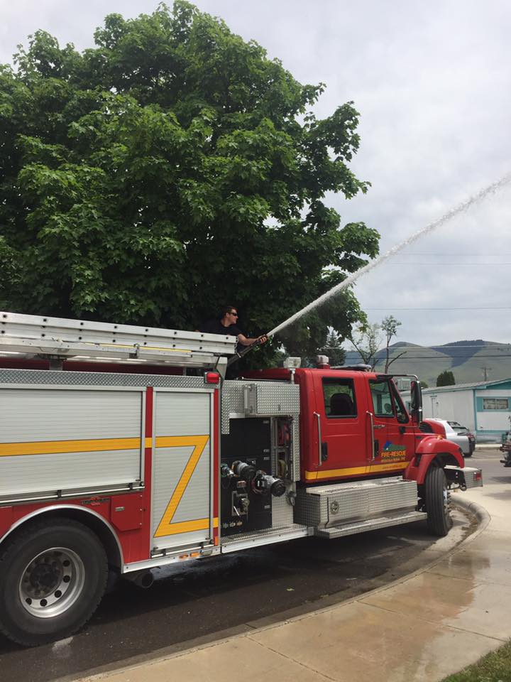 Photo of the Missoula Fire and Rescue truck fire hose being used